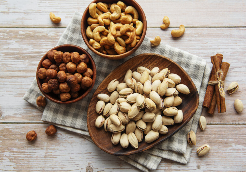 Bowls with various  nuts on a old wooden  background